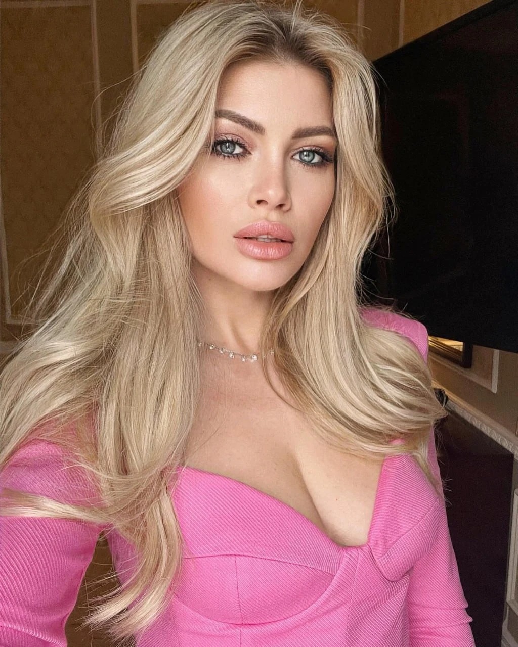 Caroline Brown in a vivid pink portrait